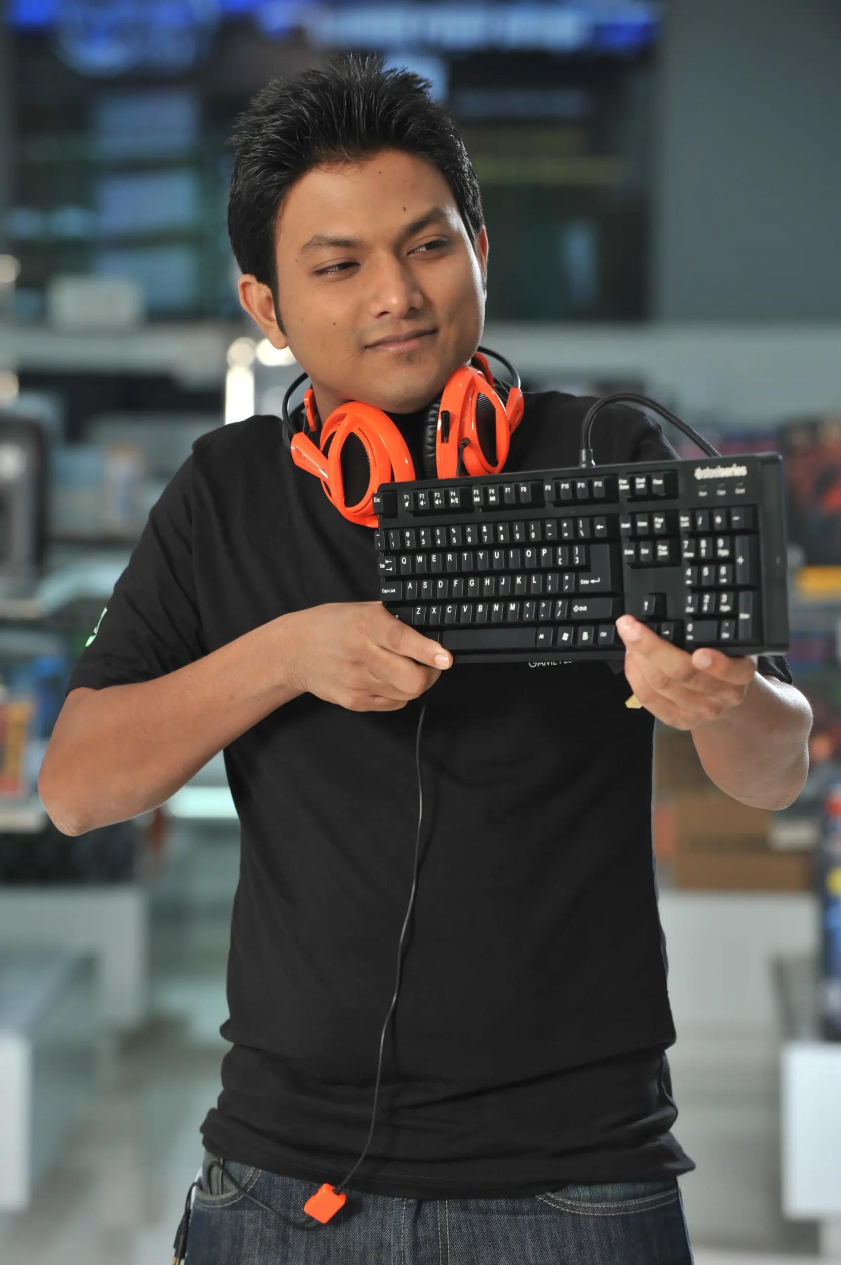 Customer enthusiastically holding a gaming PC case for Computer Source Ltd.